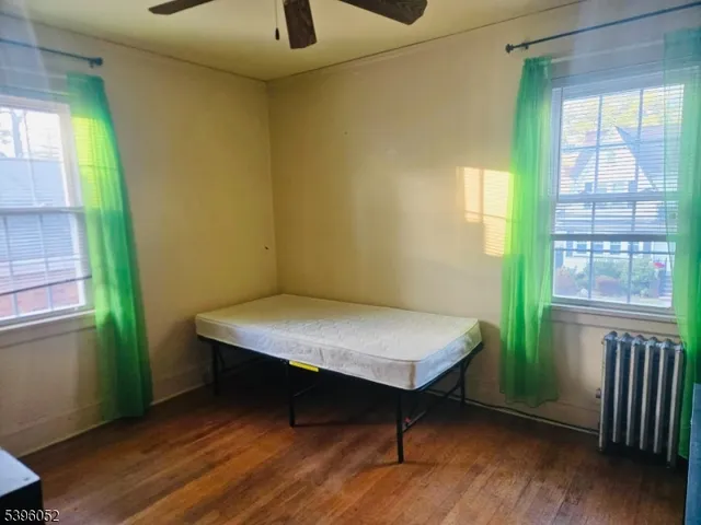 a room with a bed and a window