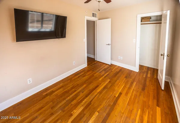 a view of empty room with a flat screen tv