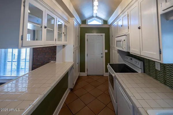 a kitchen with a sink and cabinets