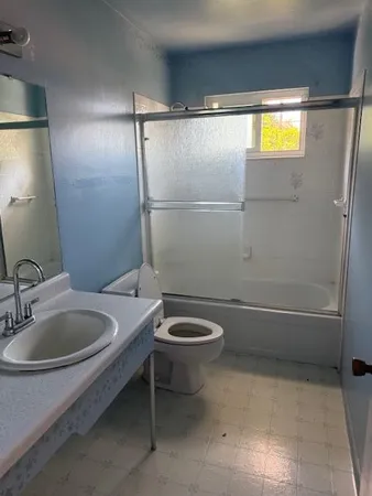 an empty room with a window and a floor