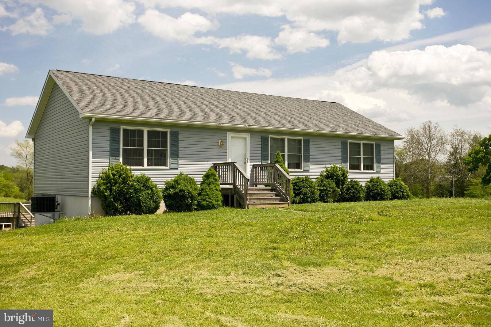 611 Veterans Road Middletown, VA 22645 - Photo 2 of 14 a view of a house with swimming pool and porch