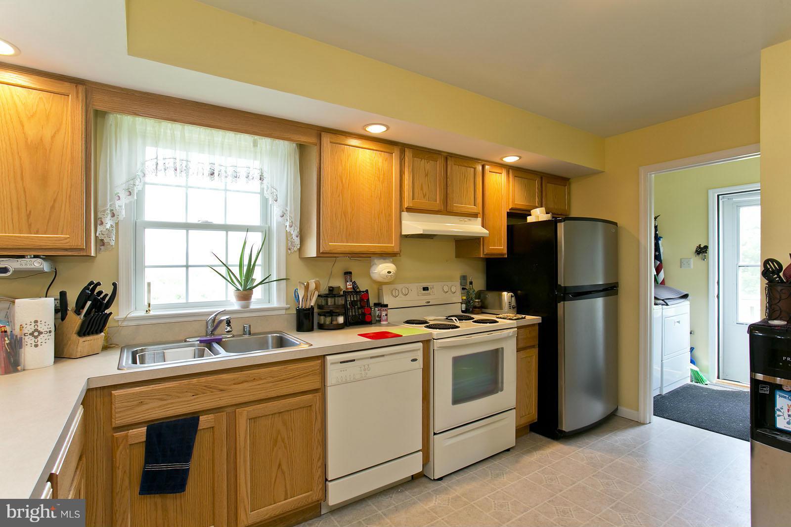 611 Veterans Road Middletown, VA 22645 - Photo 11 of 14 a kitchen with a sink cabinets and stainless steel appliances