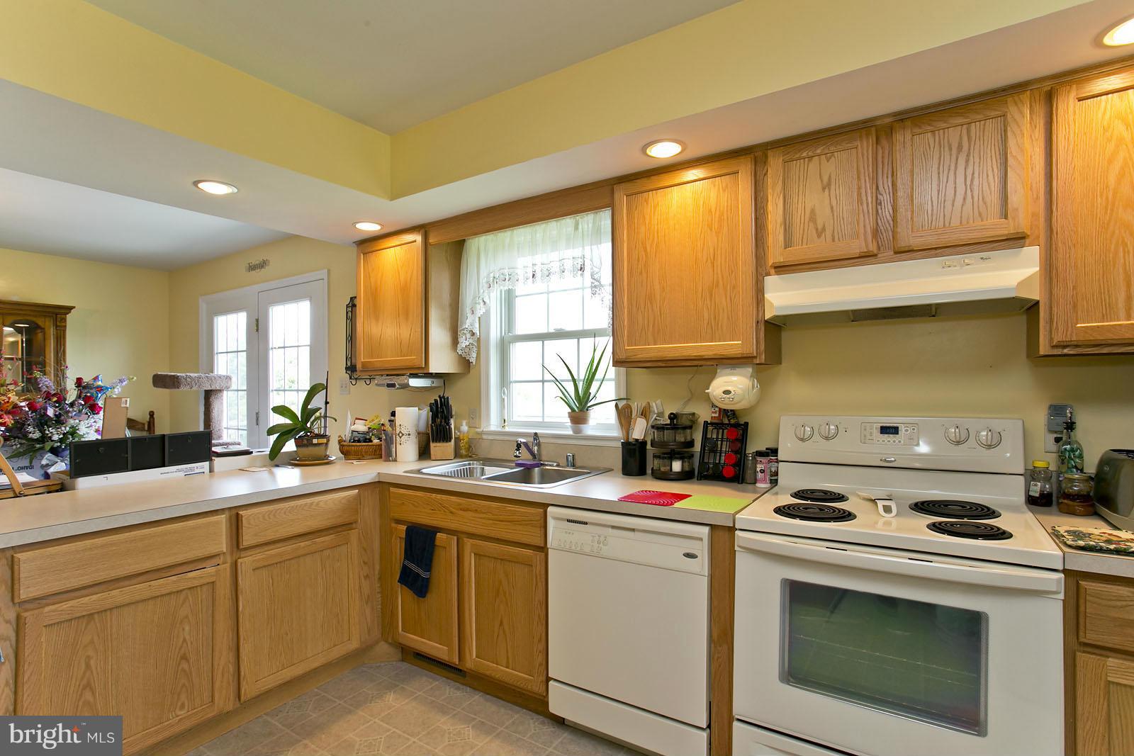 611 Veterans Road Middletown, VA 22645 - Photo 12 of 14 a kitchen with a sink stove and cabinets