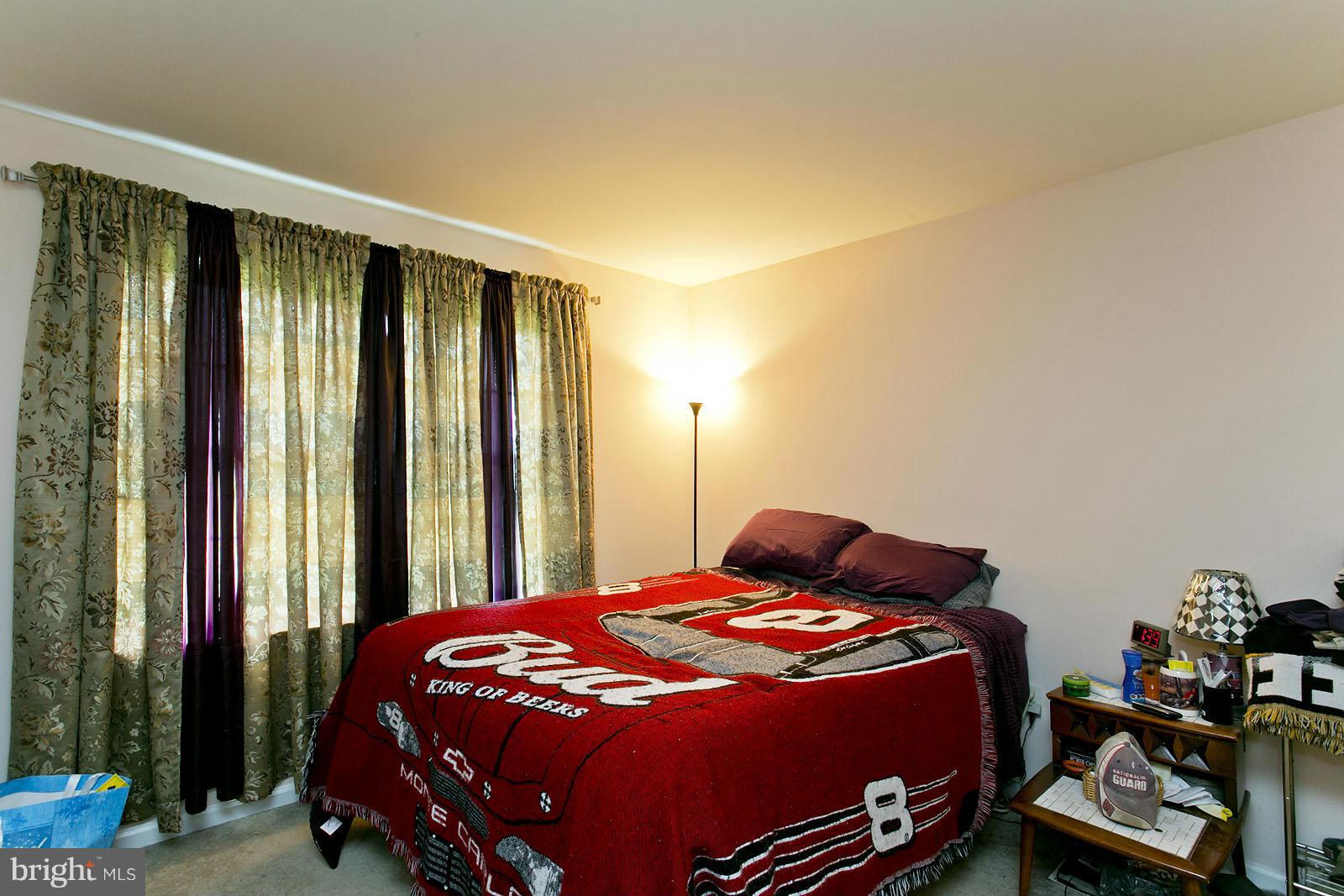 611 Veterans Road Middletown, VA 22645 - Photo 9 of 14 a bedroom with a bed and a window