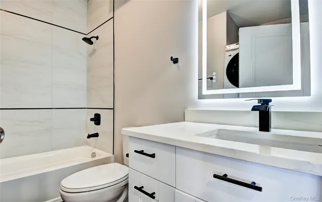 a bathroom with a sink a toilet and a bathtub