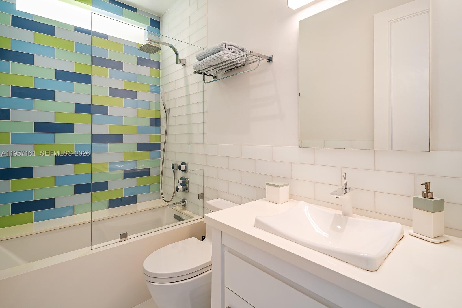 5770 Southwest 128th Street Pinecrest, FL 33156 - Photo 30 of 37 a bathroom with a sink toilet and shower