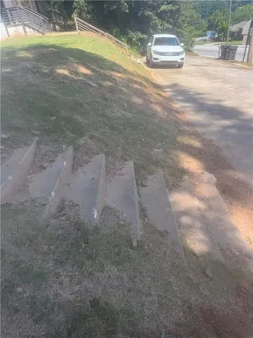 a view of outdoor space with trees all around