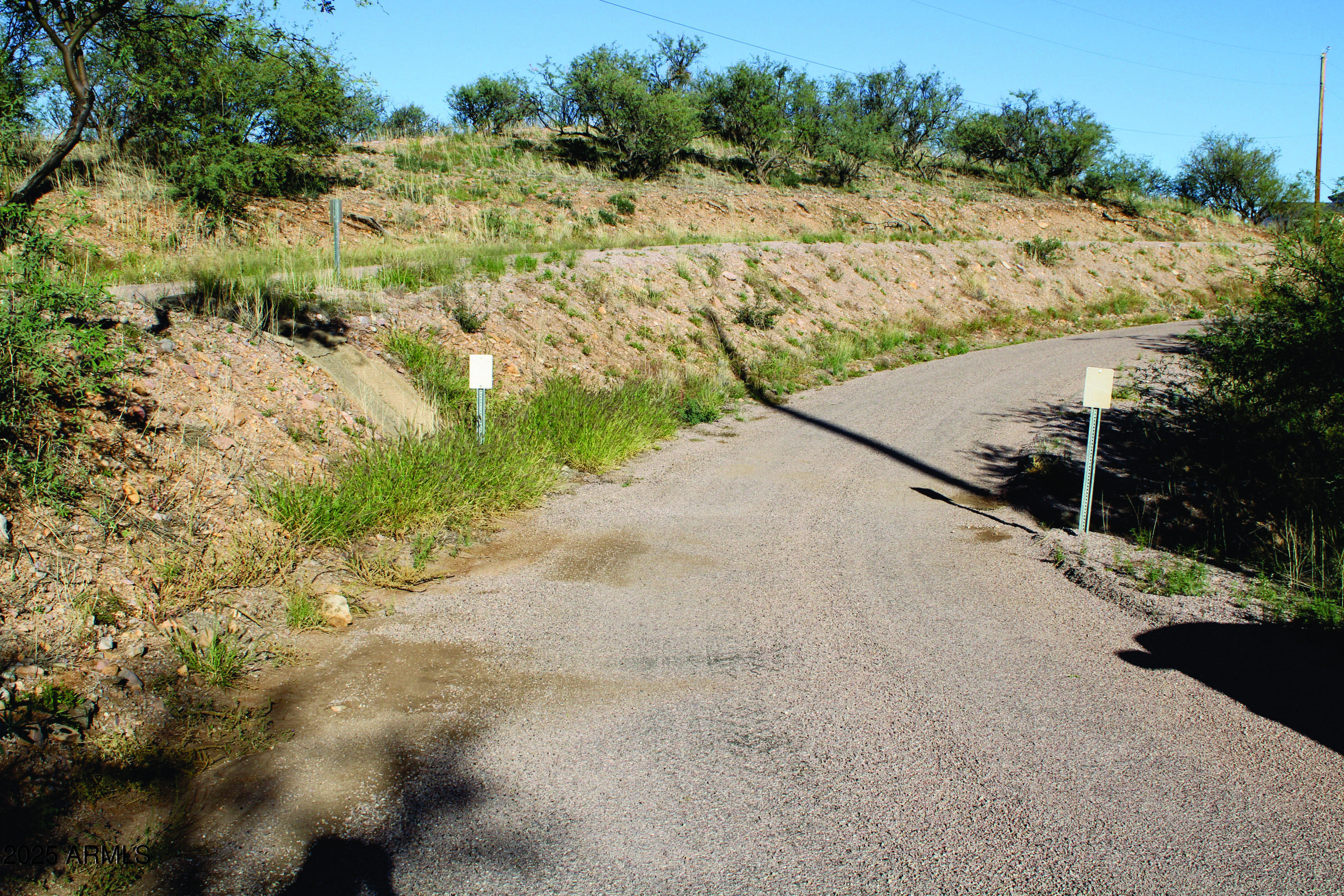 1190 Calle Chaparral, Unit 54 Rio Rico, AZ 85648 - Photo 12 of 12 a view of a road with a yard