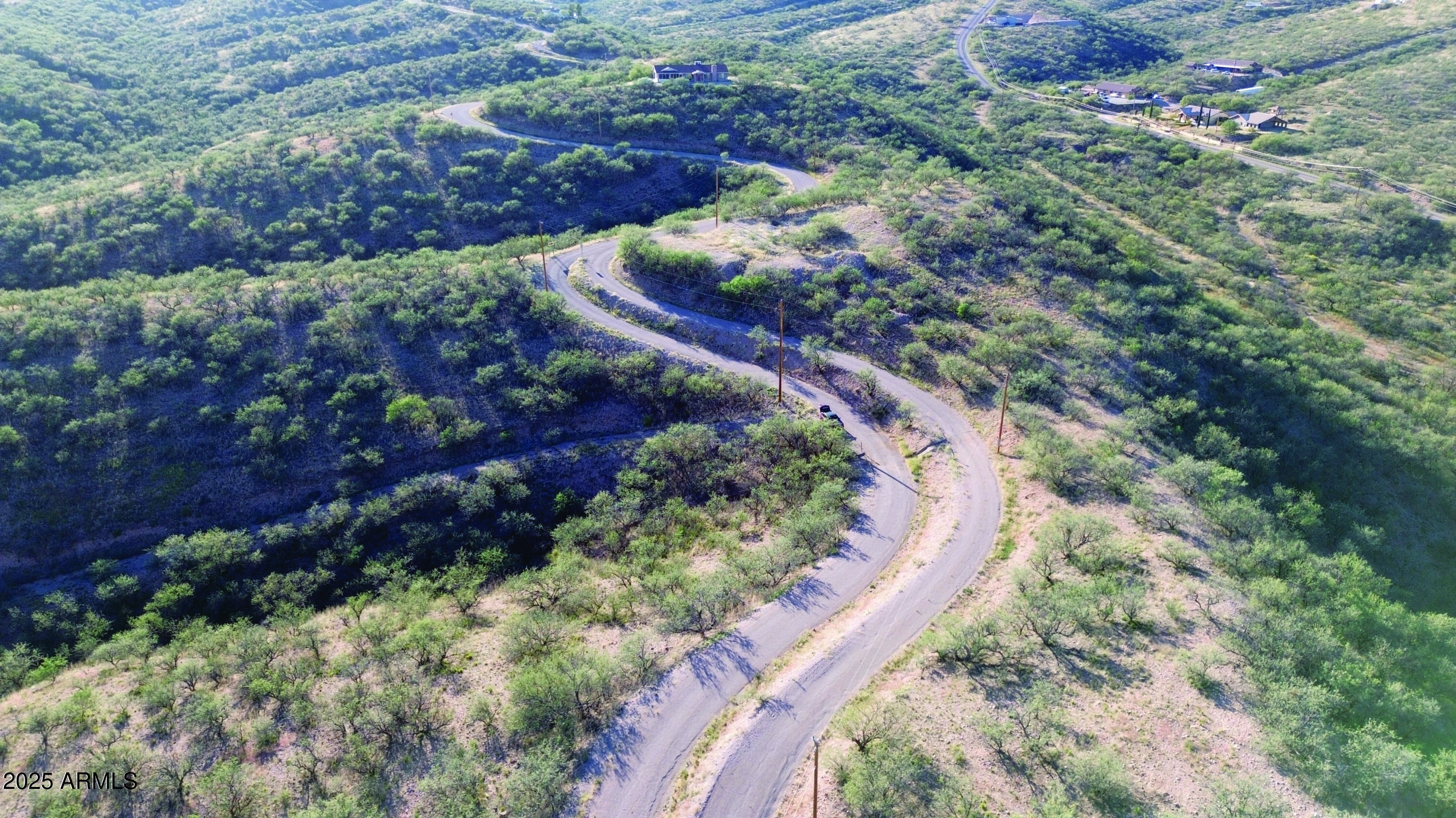 1190 Calle Chaparral, Unit 54 Rio Rico, AZ 85648 - Photo 2 of 12 a view of a forest with a yard