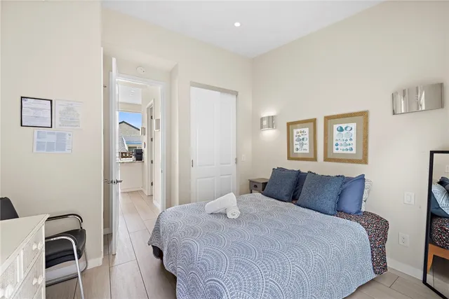 a bedroom with a bed and a cabinets