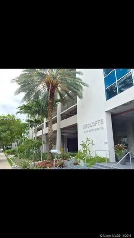 a view of a balcony with wooden floor