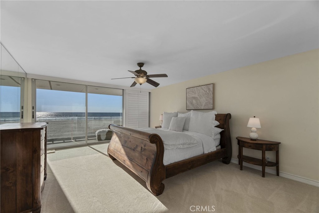 4 Jib Street, Unit 3 Marina del Rey, CA 90292 - Photo 22 of 37 a spacious bedroom with a bed and a chandelier