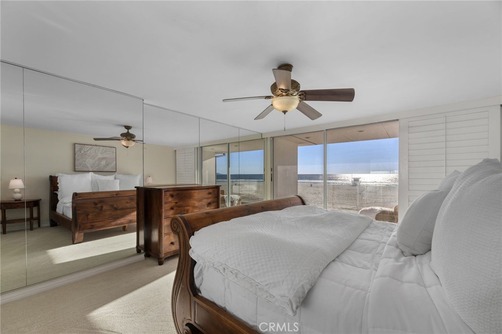 4 Jib Street, Unit 3 Marina del Rey, CA 90292 - Photo 24 of 37 a bedroom with a large bed and a chandelier