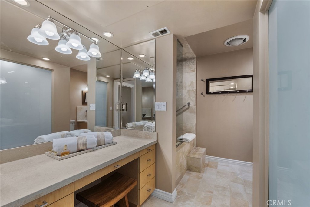 4 Jib Street, Unit 3 Marina del Rey, CA 90292 - Photo 28 of 37 a bathroom with a granite countertop sink a toilet and a mirror