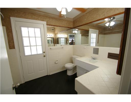 214 Doddridge Street Corpus Christi, TX 78411 - Photo 8 of 9 a bathroom with a toilet sink and mirror