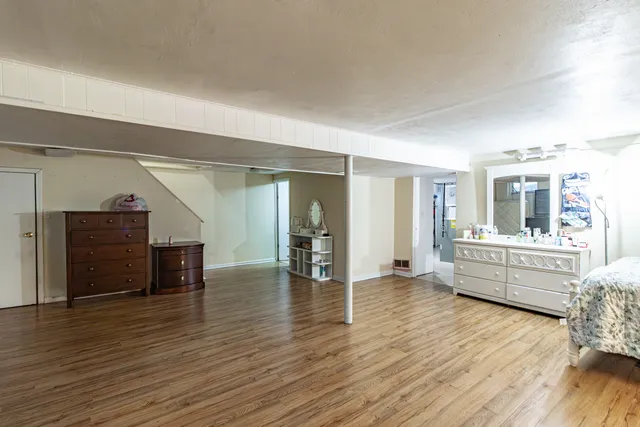 a room with furniture and wooden floor