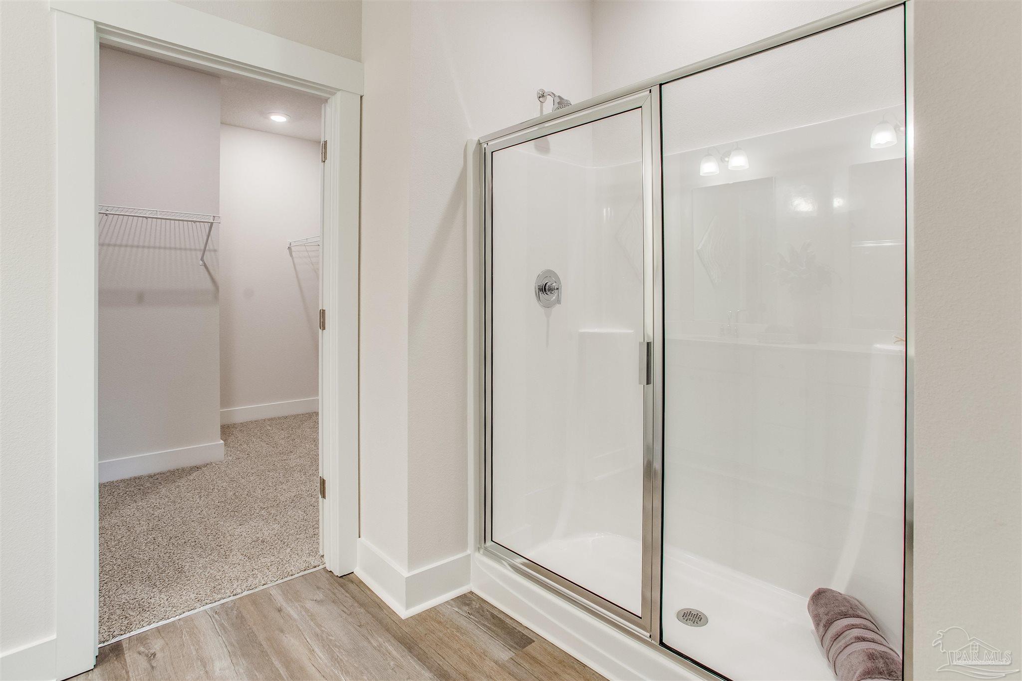 3459 Crossvine Road Cantonment, FL 32533 - Photo 17 of 38 a bathroom with a glass shower door