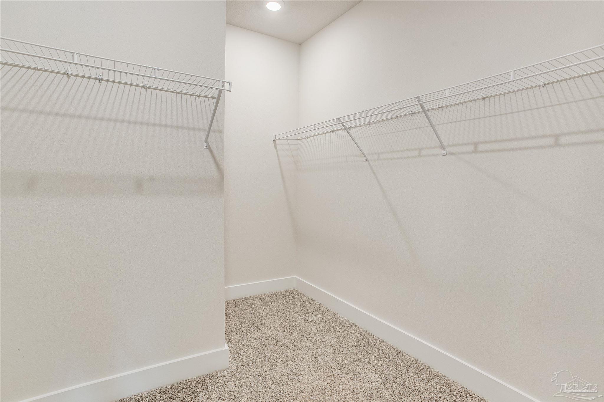 3459 Crossvine Road Cantonment, FL 32533 - Photo 18 of 38 a view of a room with racks on the wall