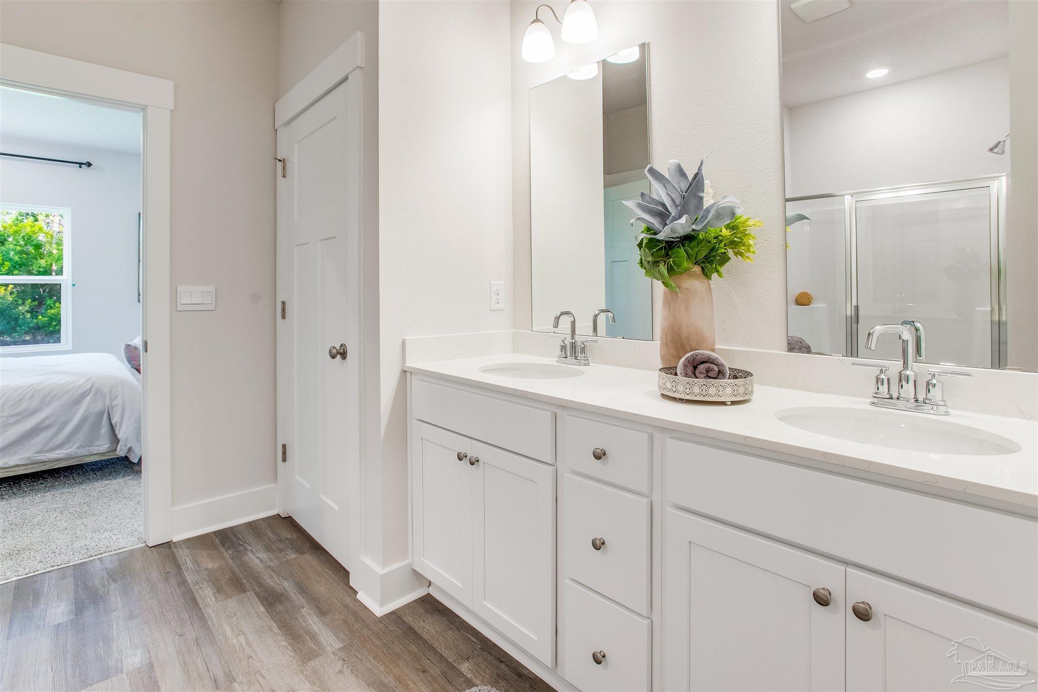 3459 Crossvine Road Cantonment, FL 32533 - Photo 19 of 38 a bathroom with a sink and a mirror
