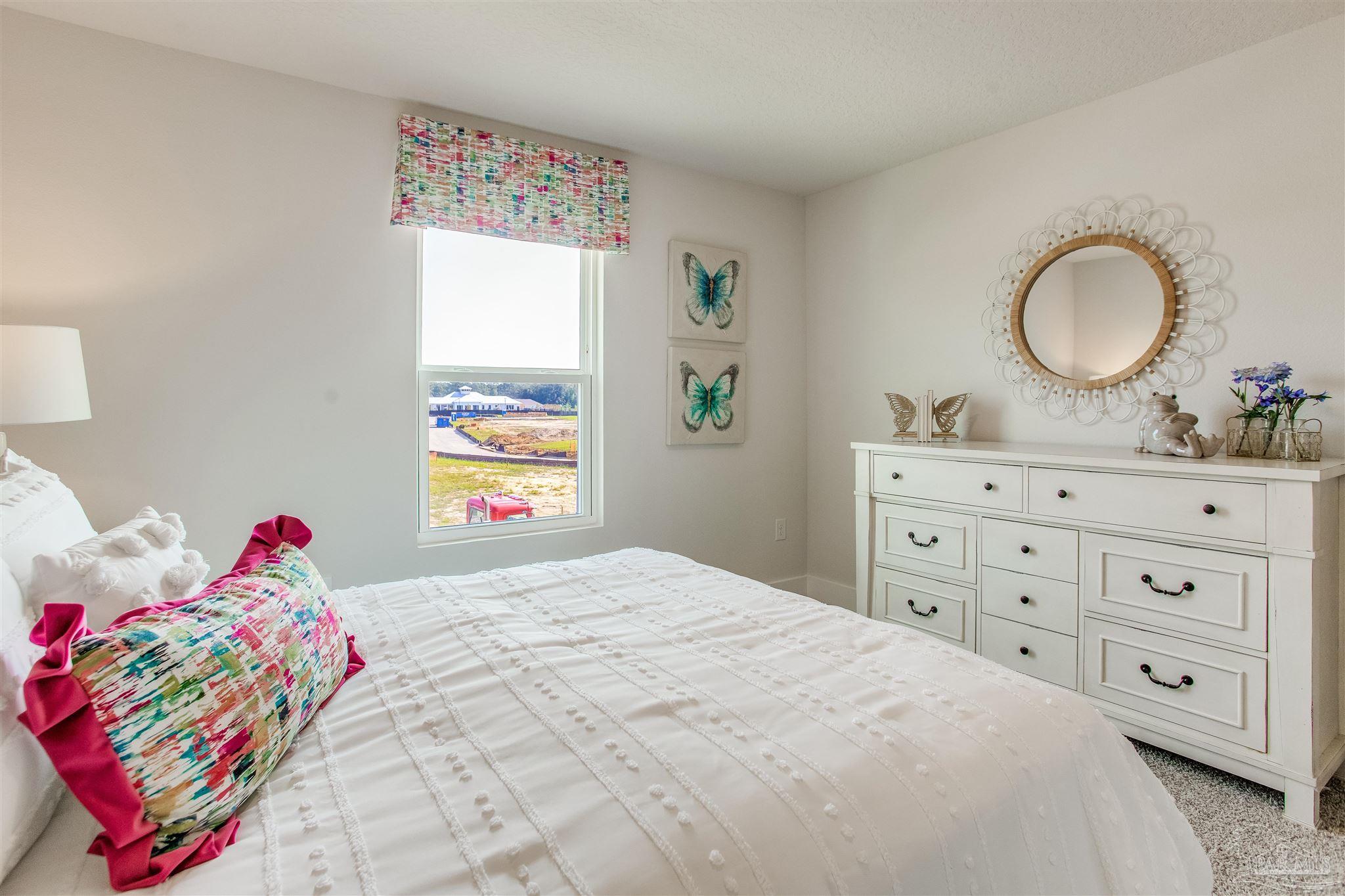 3459 Crossvine Road Cantonment, FL 32533 - Photo 27 of 38 a bedroom with a bed and a dresser