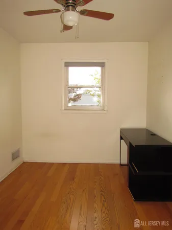 a view of an empty room and a window