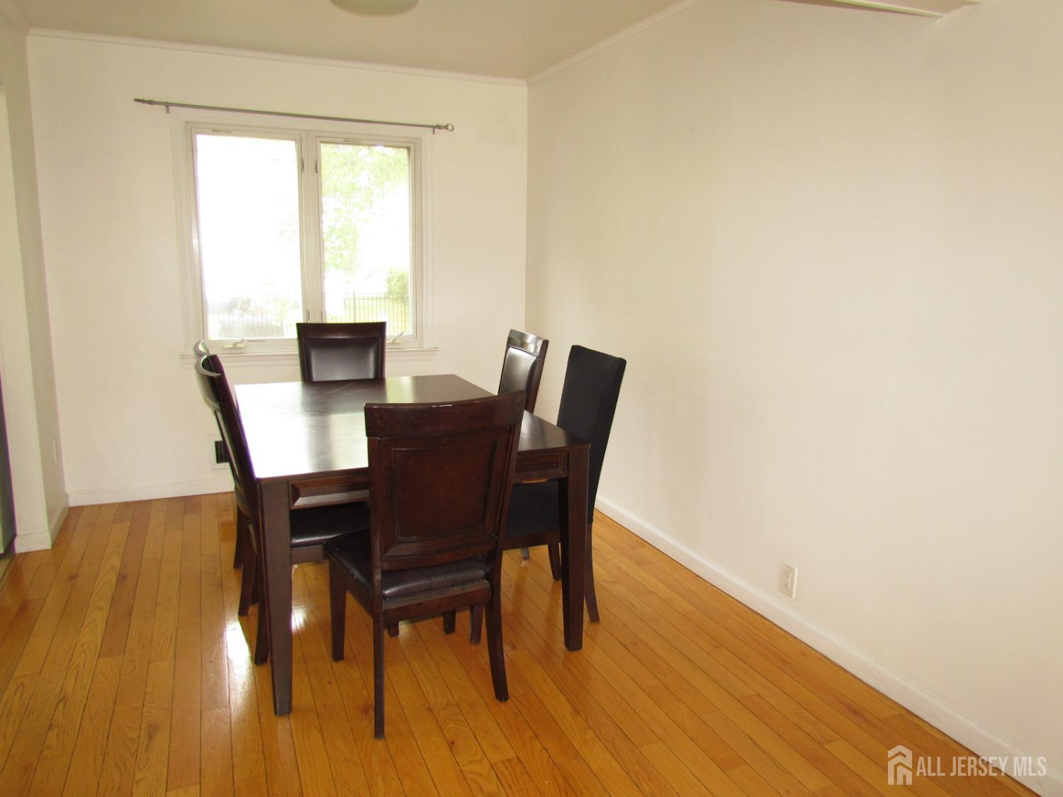 10 Willow Avenue Edison, NJ 08817 - Photo 3 of 17 a view of a dining room with furniture and wooden floor