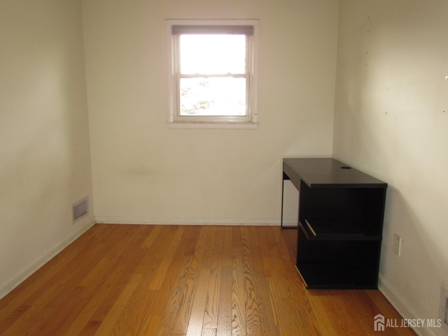 10 Willow Avenue Edison, NJ 08817 - Photo 10 of 17 an empty room with a window