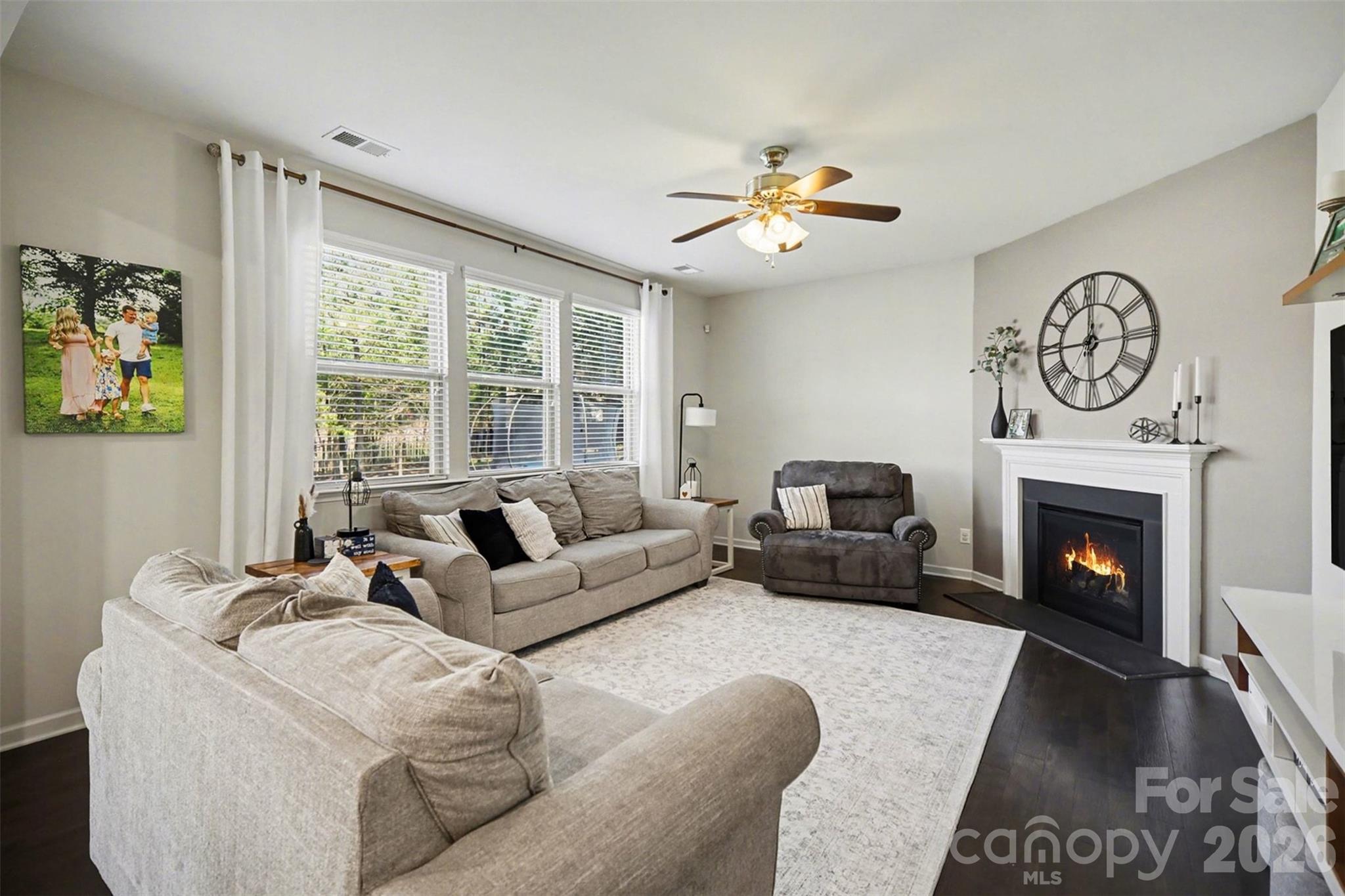 514 Tack Lane Midland, NC 28107 - Photo 19 of 48 a living room with furniture a large window and a fireplace
