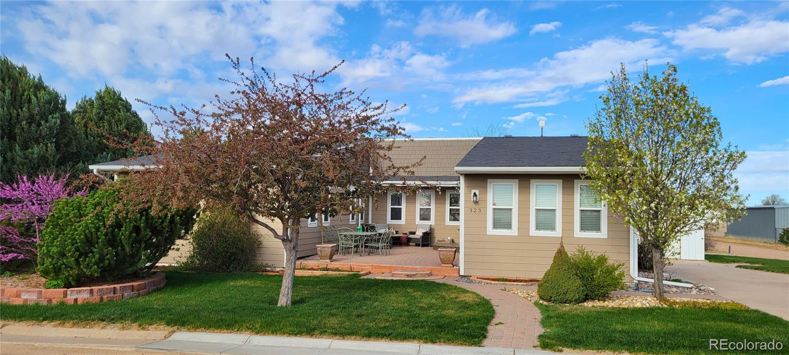 323 Fairview Street Otis, CO 80743 - Photo 1 of 38 a house view with a garden space