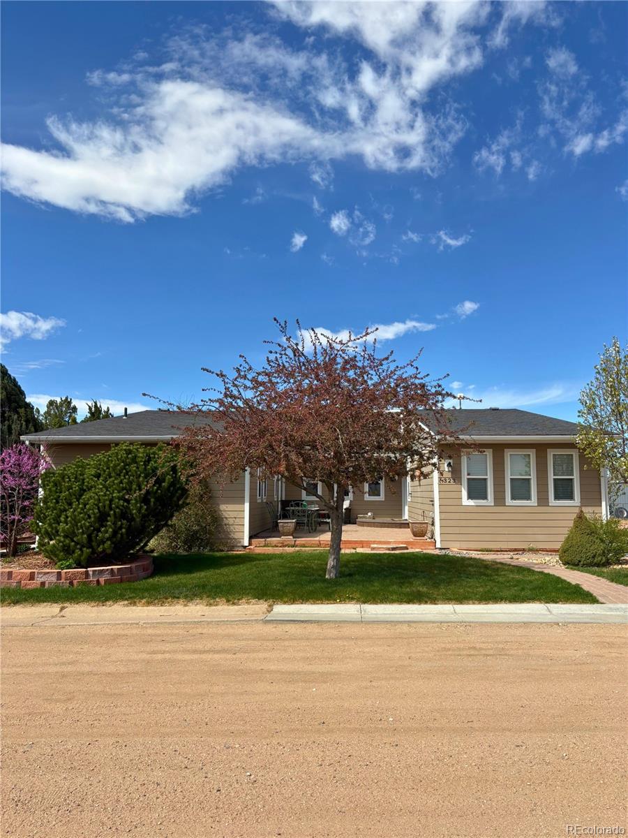 323 Fairview Street Otis, CO 80743 - Photo 2 of 38 a view of a house with a yard