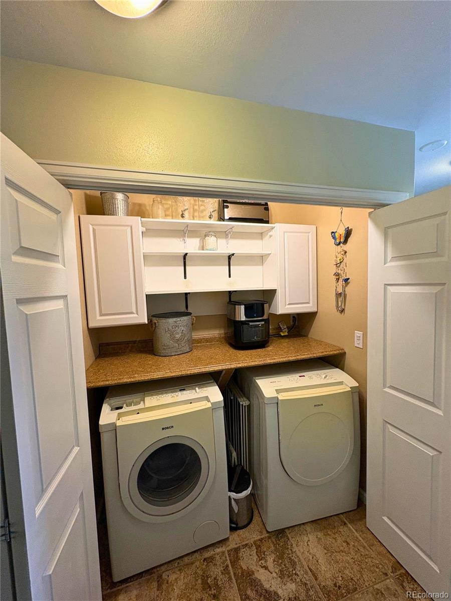 323 Fairview Street Otis, CO 80743 - Photo 21 of 38 a utility room with dryer and washer