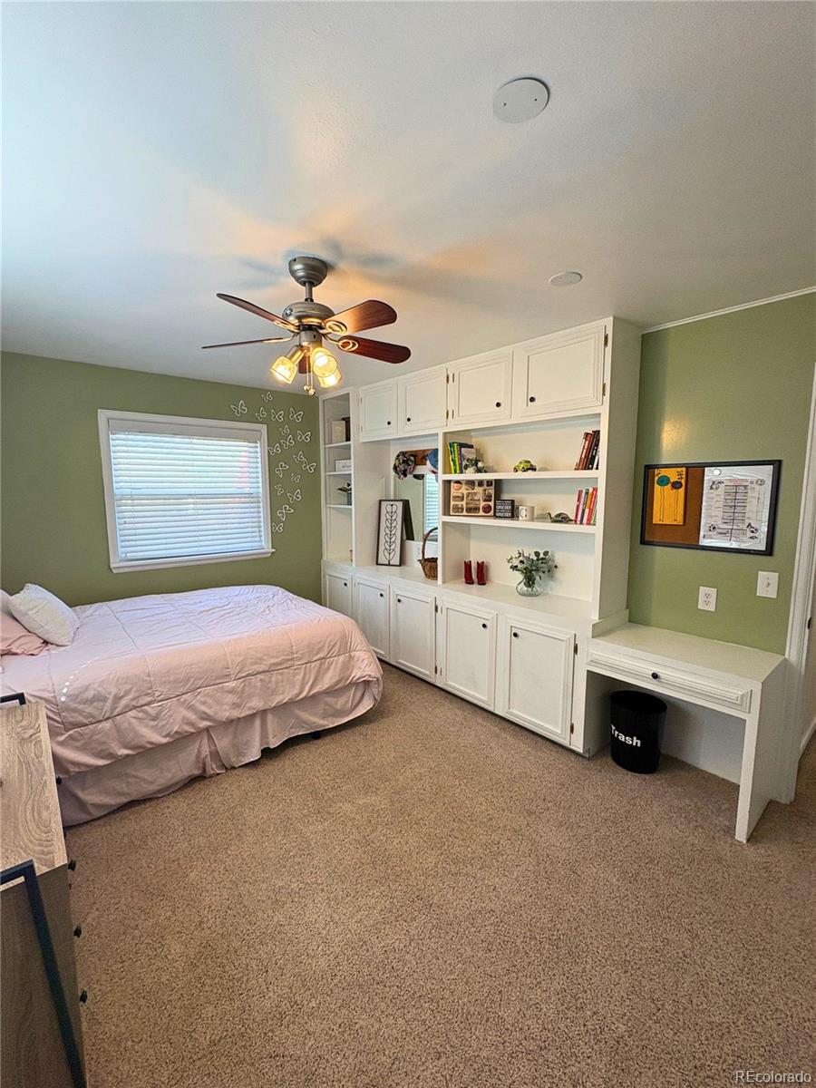 323 Fairview Street Otis, CO 80743 - Photo 22 of 38 a bedroom with a bed dresser and window