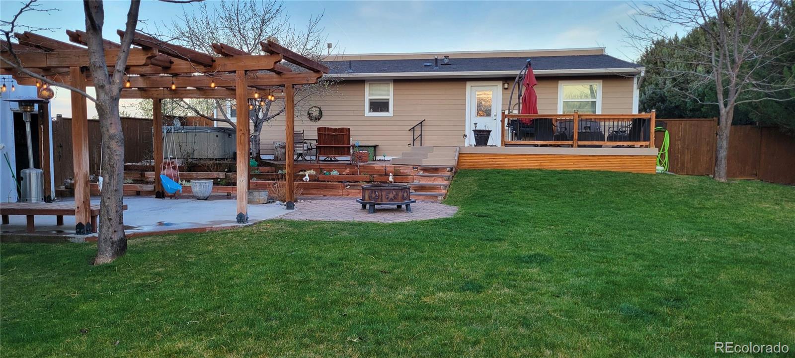 323 Fairview Street Otis, CO 80743 - Photo 33 of 38 a view of a house with a yard porch and sitting area
