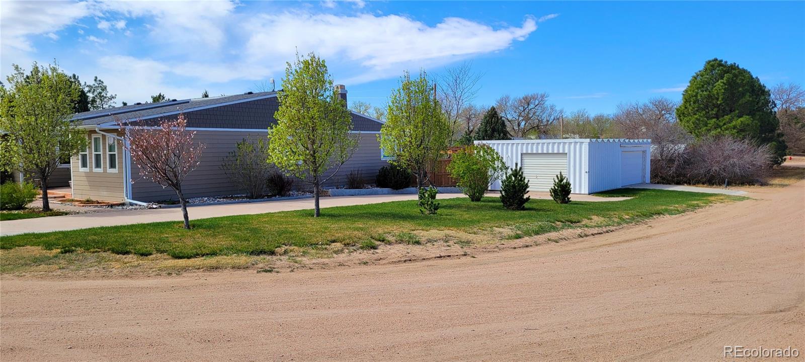 323 Fairview Street Otis, CO 80743 - Photo 5 of 38 front view of a house with a yard