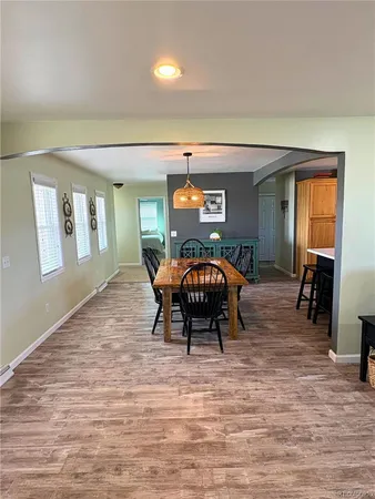a bedroom with furniture and a wooden floor