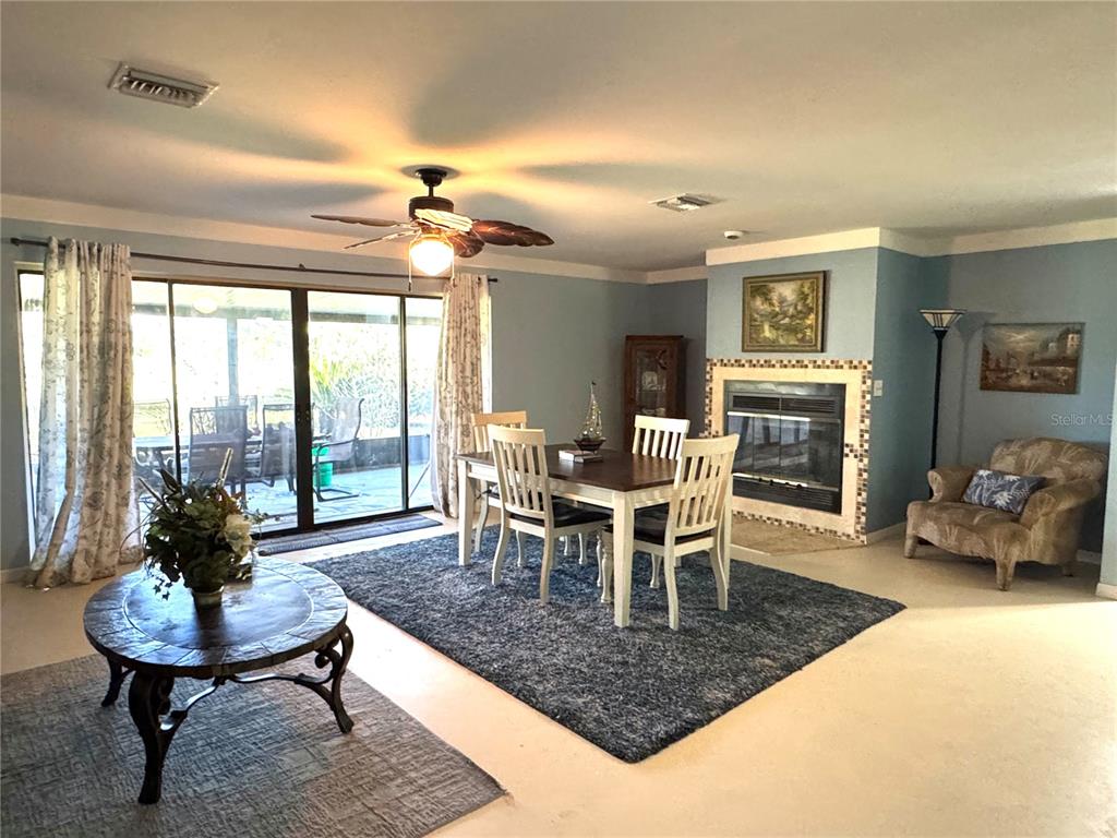 7425 South Irma Point Lecanto, FL 34461 - Photo 6 of 61 a dining room with furniture window and a chandelier