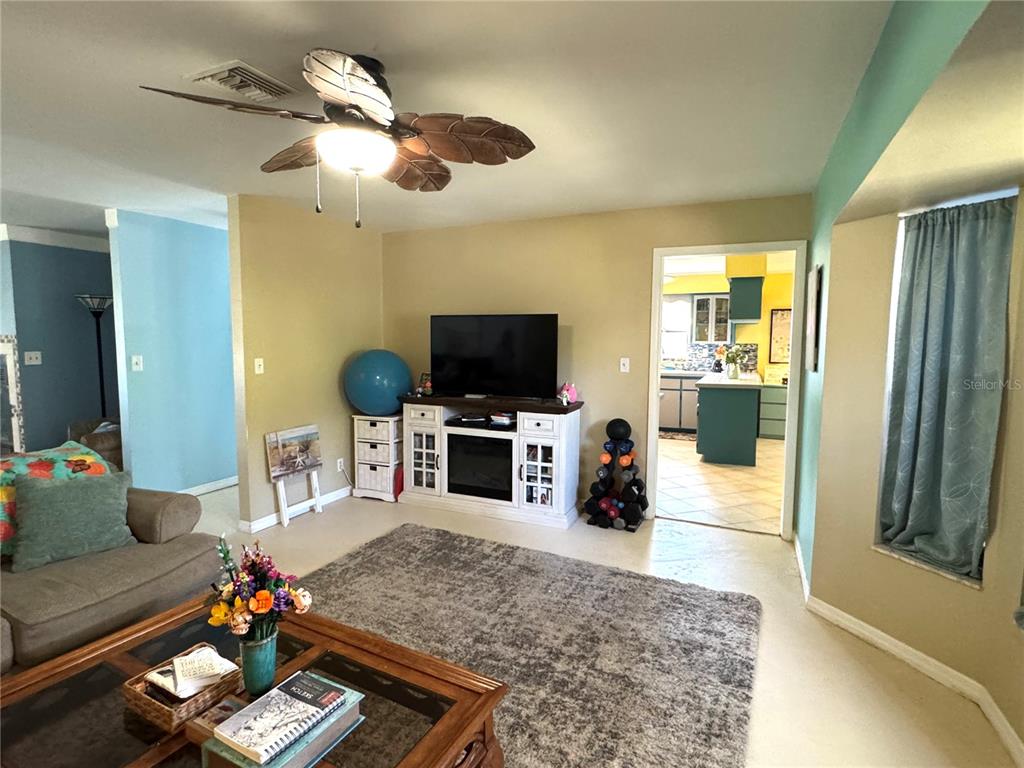 7425 South Irma Point Lecanto, FL 34461 - Photo 8 of 61 a living room with furniture and a flat screen tv