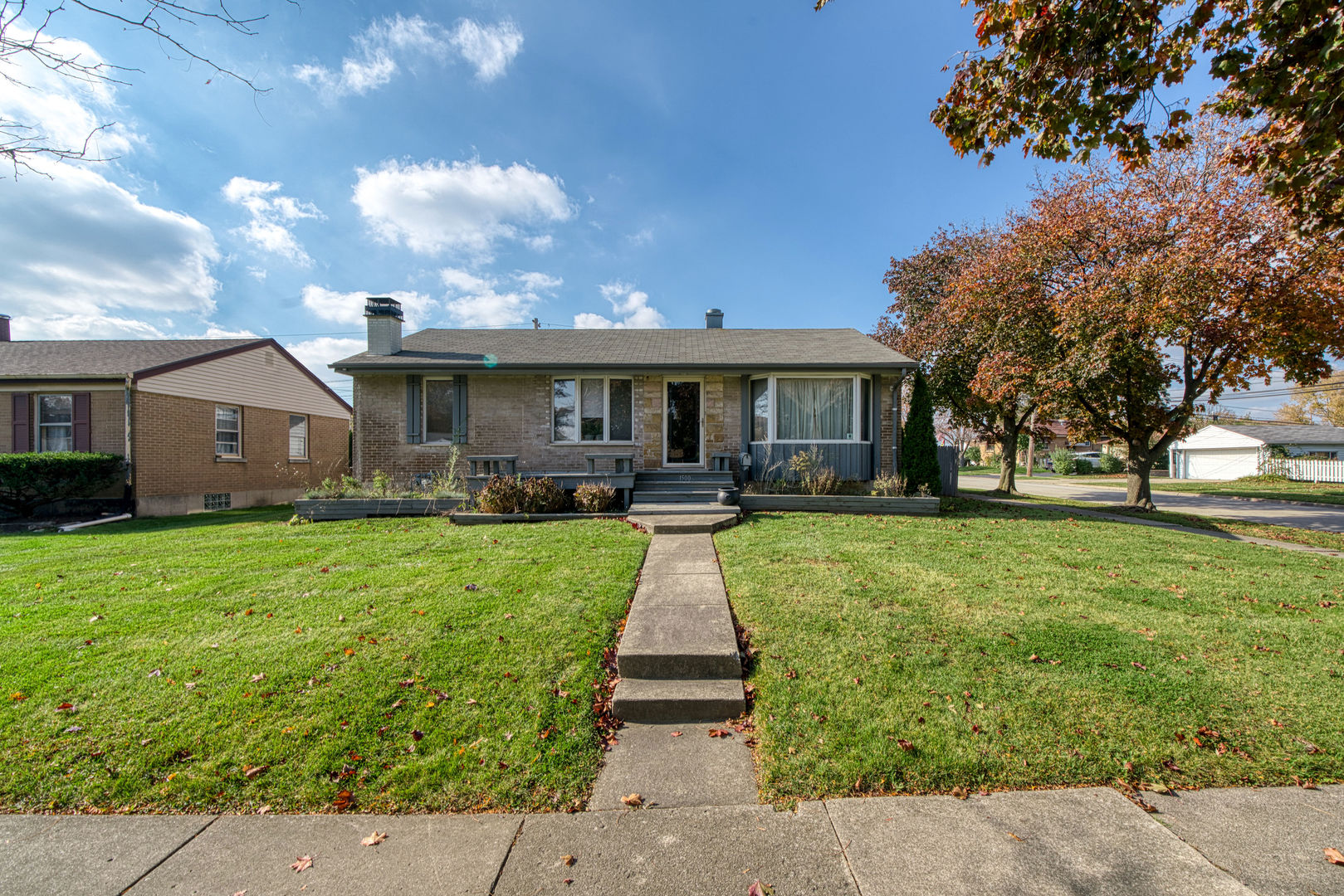 1500 Harding Avenue Berkeley, IL 60163 - Photo 2 of 22 a front view of house with yard and green space