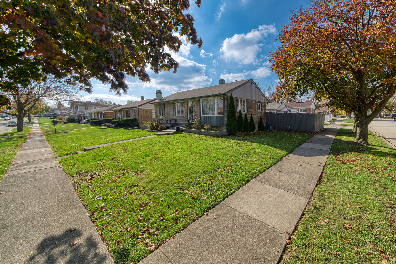 1500 Harding Avenue Berkeley, IL 60163 - Photo 3 of 22 a front view of a house with a yard and trees
