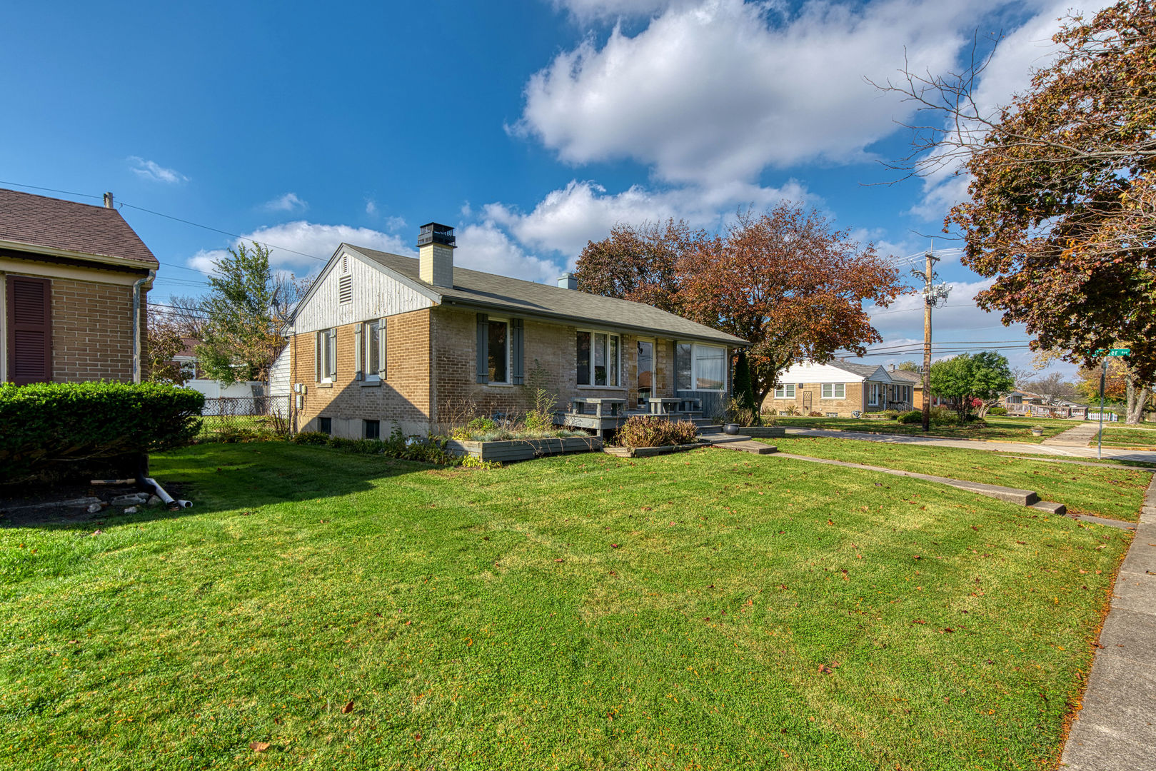 1500 Harding Avenue Berkeley, IL 60163 - Photo 4 of 22 a front view of a house with garden and porch