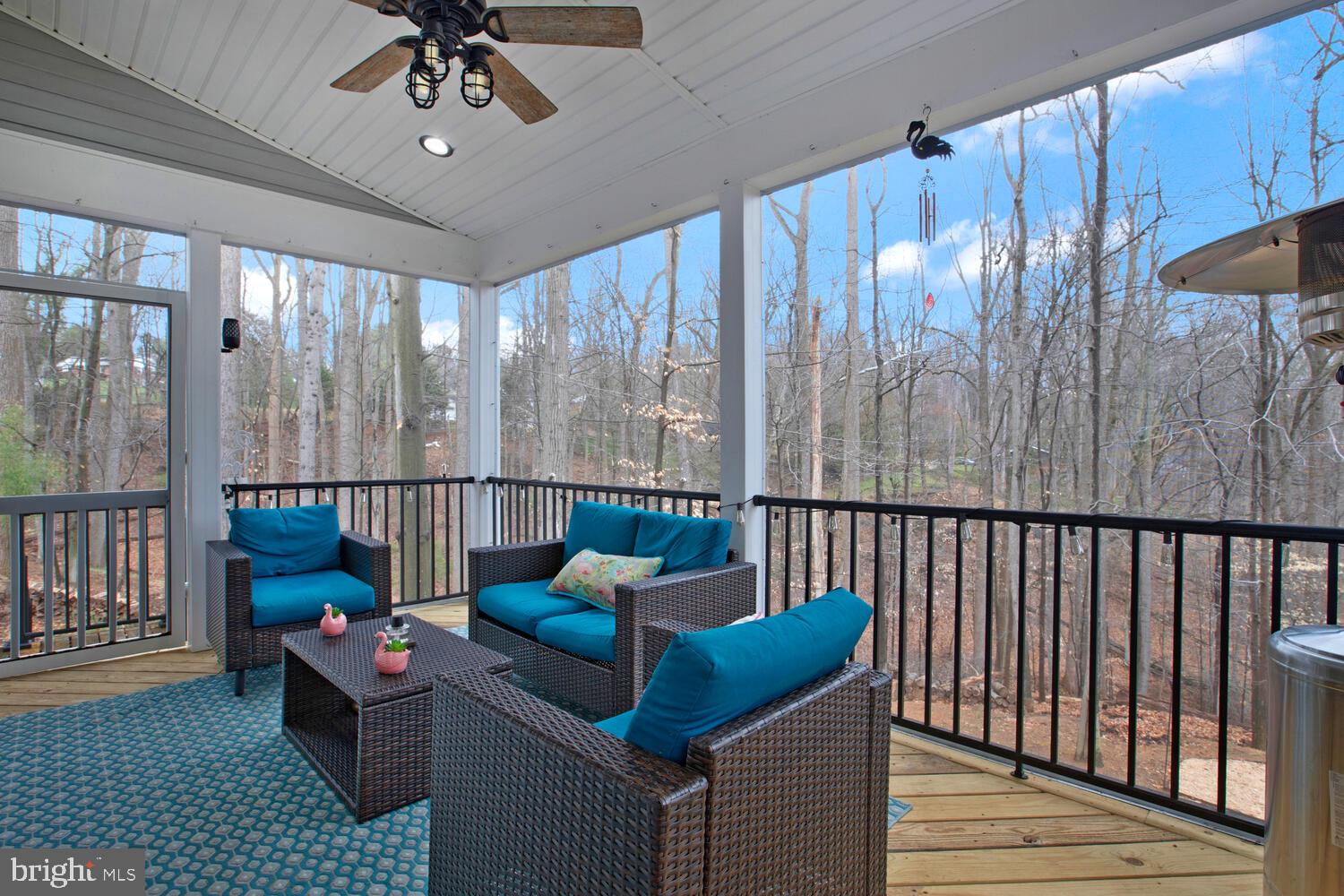 1505 Pinnacle Road Towson, MD 21286 - Photo 11 of 34 a balcony with furniture and a chandelier