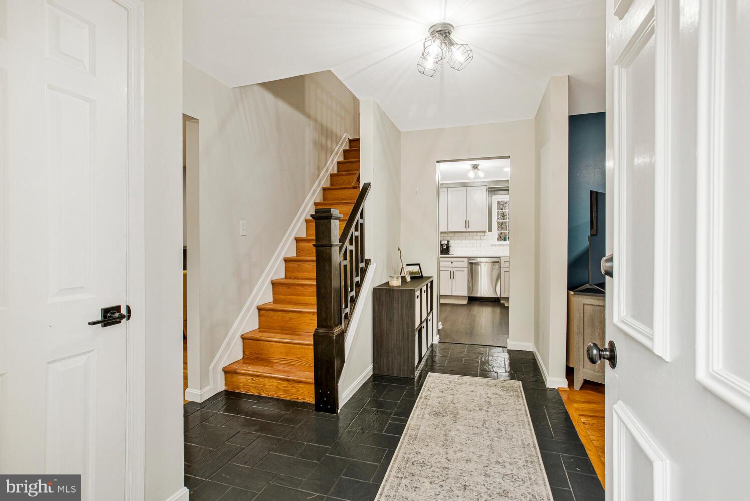 1505 Pinnacle Road Towson, MD 21286 - Photo 2 of 34 a view of a hallway with wooden floor and staircase