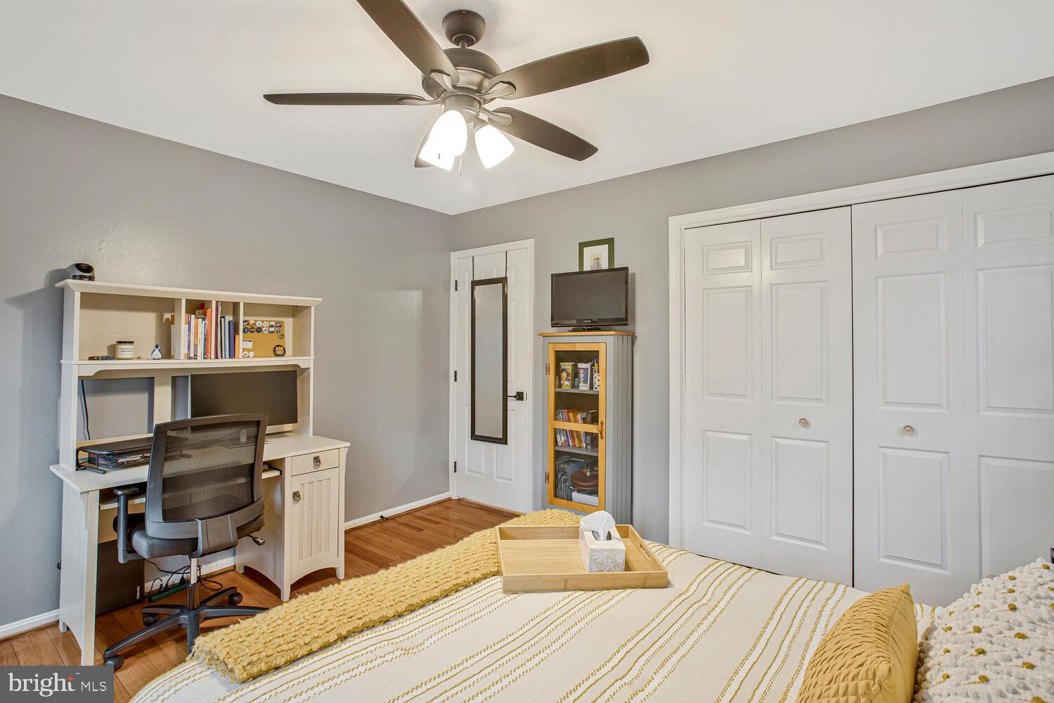 1505 Pinnacle Road Towson, MD 21286 - Photo 21 of 34 a bedroom with a bed and a chandelier