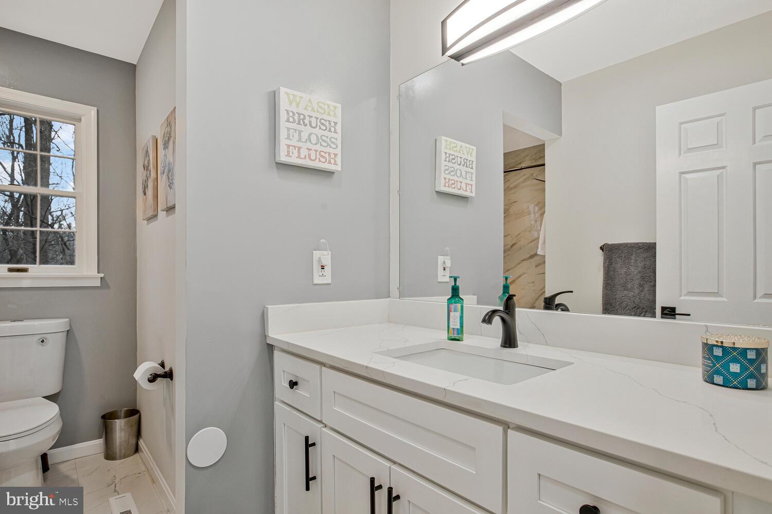 1505 Pinnacle Road Towson, MD 21286 - Photo 22 of 34 a bathroom with a sink toilet and vanity
