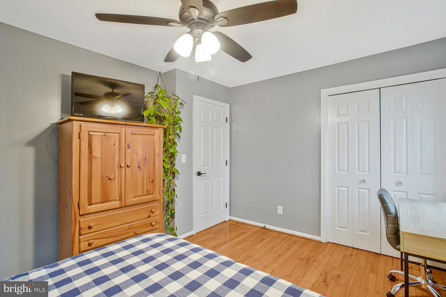 1505 Pinnacle Road Towson, MD 21286 - Photo 26 of 34 a bedroom with a bed and a chandelier