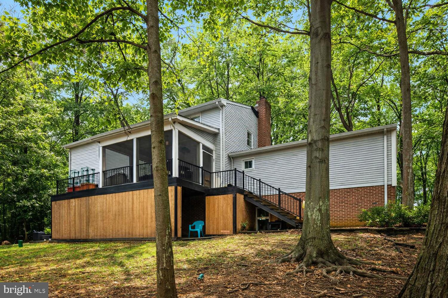 1505 Pinnacle Road Towson, MD 21286 - Photo 29 of 34 a view of a wooden house with large trees and large tree