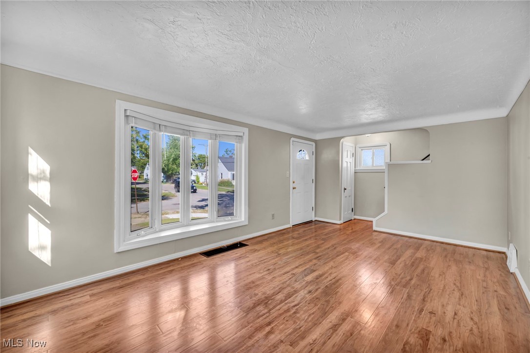 12930 Havana Road Cleveland, OH 44125 - Photo 11 of 37 Living room featuring wood flooring and plenty of natural light