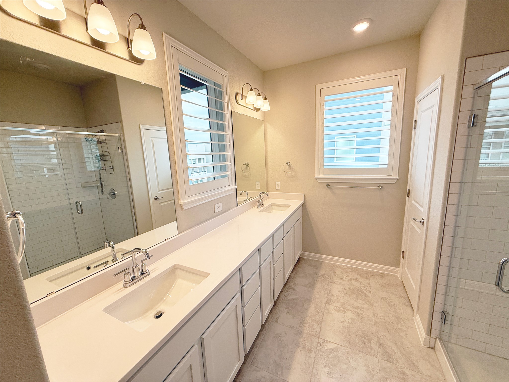9015 Cattle Baron Path, Unit 605 Austin, TX 78747 - Photo 10 of 20 Full bathroom with a sink and a stall shower