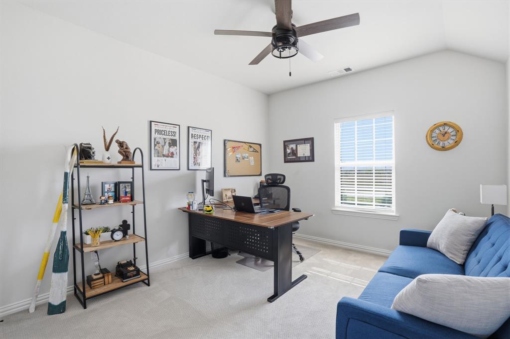 4202 Crown Run Road Midlothian, TX 76065 - Photo 22 of 34 Spacious entertainment room featuring a large projection screen, recessed lighting, wall-mounted floating shelves, and plush carpet flooring