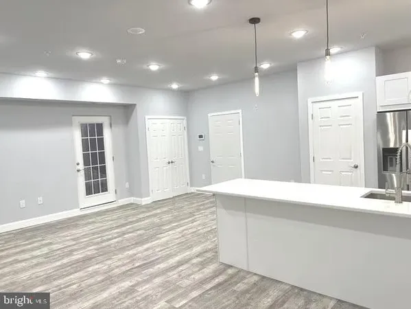 a bathroom with a sink a vanity and a shower